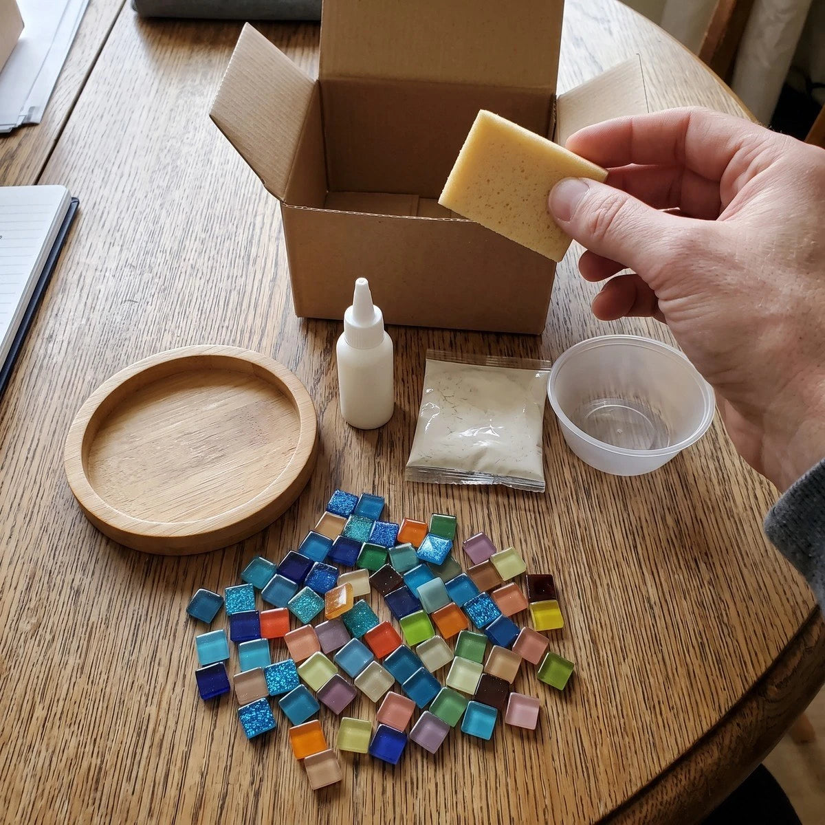 Finished colourful coaster beside breakfast on a kitchen counter